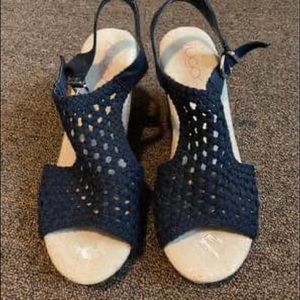 Women’s size 9, navy blue knit wedges. Never worn